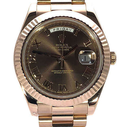 Rolex Day-Date II 18 kt Roségold Uhr mit braunem Zifferblatt und Tagesanzeige.
