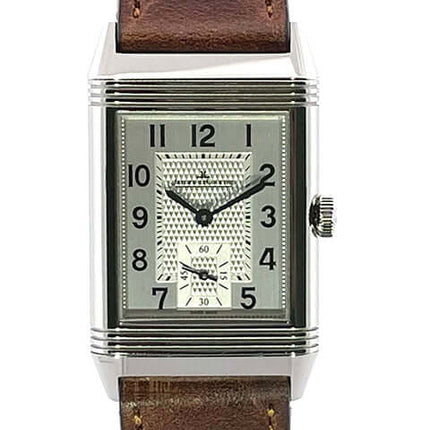 Jaeger-LeCoultre Reverso Herrenuhr mit braunem Lederarmband und rechteckigem silbernem Zifferblatt.