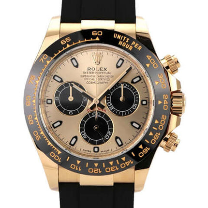 Rolex Daytona 116518LN in Gelbgold mit schwarzem Oysterflex-Band und champagnerfarbenem Zifferblatt.