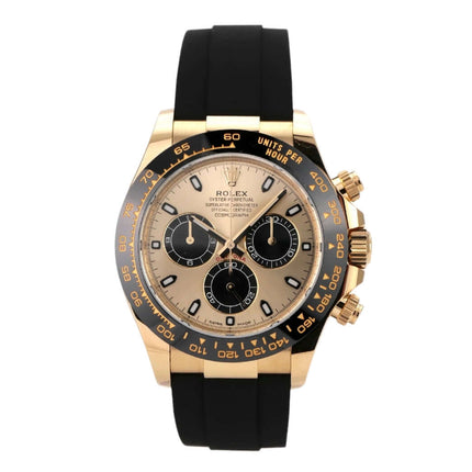 Rolex Daytona 116518LN in 18 kt Gelbgold mit schwarzem Oysterflex-Band und champagnerfarbenem Zifferblatt.