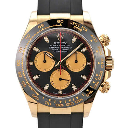 Rolex Daytona 116518LN Gelbgold Oysterflex Schwarz Champagner mit schwarzem Zifferblatt und champagnerfarbenen Totalisatoren.