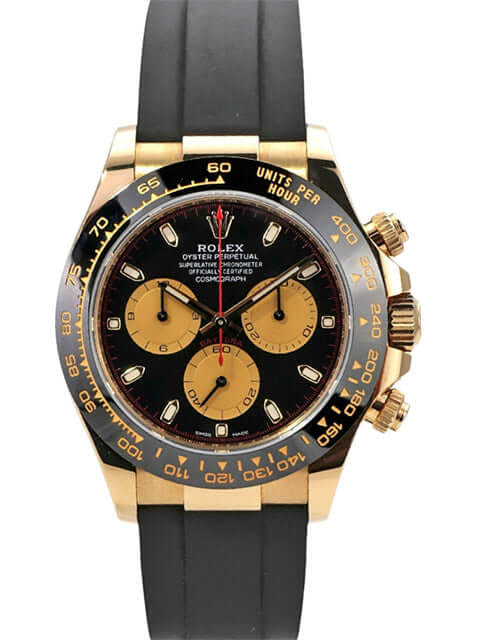 Rolex Daytona 116518LN in Gelbgold mit schwarzem Oysterflex-Band und champagnerfarbenen Totalisatoren.