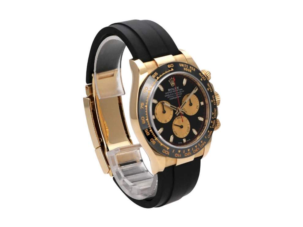 Rolex Daytona 116518LN Gelbgold mit schwarzem Oysterflex-Band und champagnerfarbenen Totalisatoren.