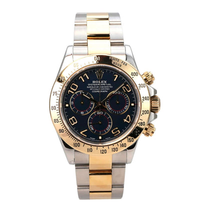 Rolex Daytona Cosmograph 116523 Blau Arabisch auf einem Edelstahl- und Gelbgold-Armband mit blauem Zifferblatt.