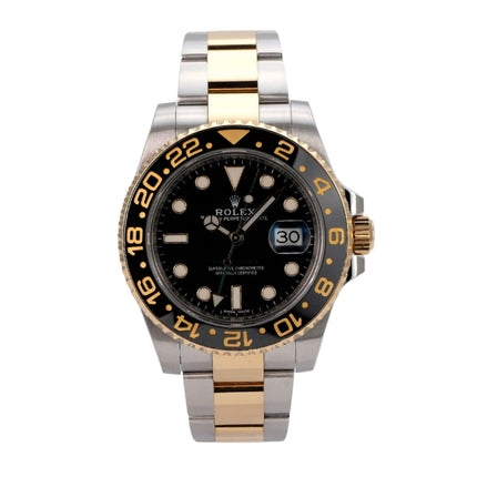 Rolex GMT-Master II 116713LN mit schwarzem Zifferblatt und 18 kt Gelbgold-Lünette