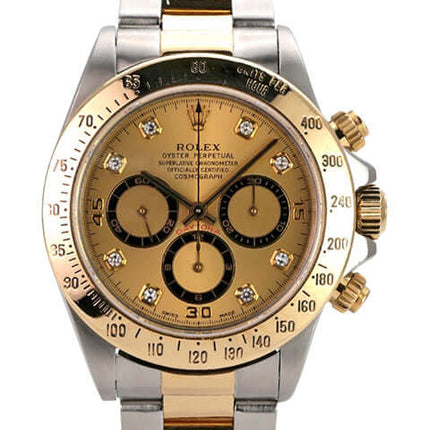 Rolex Daytona 40 Edelstahl Gelbgold 16523 Champagner Diamant mit Champagne Zifferblatt und goldenen Akzenten.