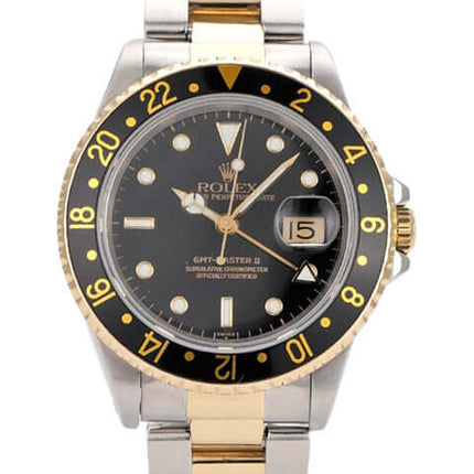 Rolex GMT-Master II 16713 in Edelstahl und Gelbgold, 40mm, schwarzes Zifferblatt, drehbare Lünette, leuchtende Indizes.