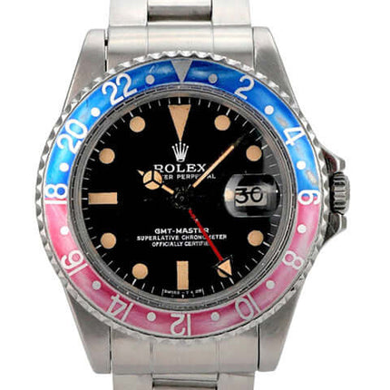 Rolex GMT Master Pepsi Ref. 1675 mit schwarzem Zifferblatt und blau-roter Lünette, Edelstahlarmband.