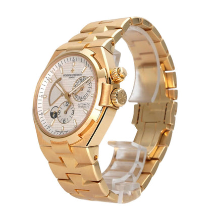 Vacheron Constantin Overseas Dual Time 47450/B01J-9228 in polished yellow gold with a silver dial and automatic movement.