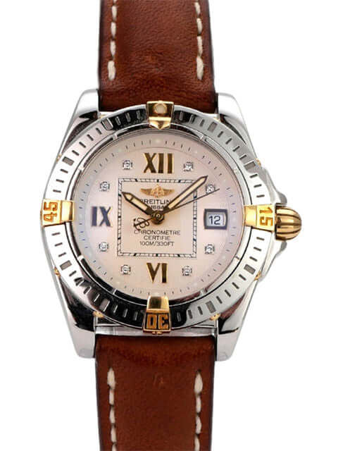 Breitling Cockpit Lady Ref. B71356-041 mit Edelstahl- und Gelbgold-Lünette, braunem Lederband und silberfarbenem Zifferblatt.