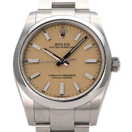 Rolex Oyster Perpetual 34 mm 124200 Beige Uhr mit beigem Zifferblatt und Edelstahlband.