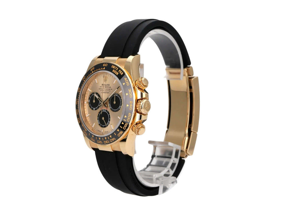 Rolex Daytona 126518LN Gelbgold Oysterflex Champagner mit schwarzem Band und champagnerfarbenem Zifferblatt.