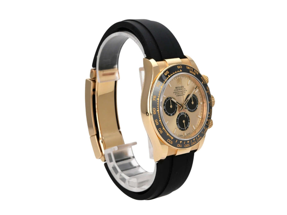 Rolex Daytona 126518LN Gelbgold Oysterflex Champagner mit schwarzem Band und champagnerfarbenem Zifferblatt.