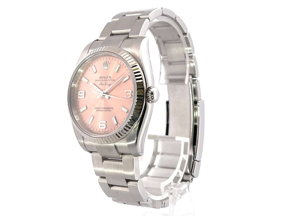 Rolex Air King Ref. 114234 mit rosafarbenem Zifferblatt, Edelstahlgehäuse und Oyster-Armband, Weißgold Lünette, arabische Indizes 9, 6, 3.