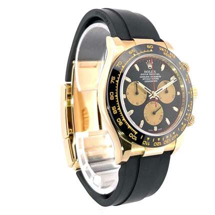Rolex Daytona 116518LN Gelbgold Oysterflex mit schwarzem Zifferblatt und champagnerfarbenen Totalisatoren.