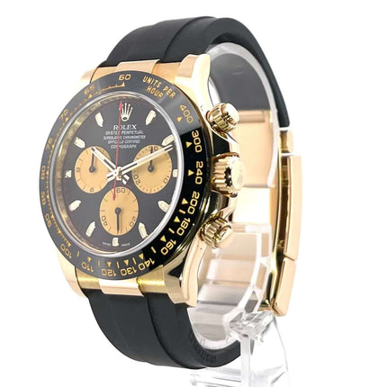Rolex Daytona 116518LN Gelbgold mit schwarzem Oysterflex-Band, schwarz-champagnerfarbenes Zifferblatt und Keramik-Lünette, 40 mm Gehäuse.