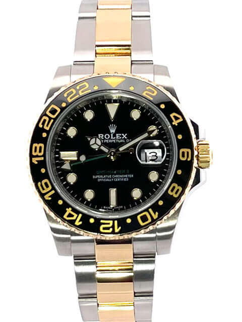 Rolex GMT-Master II Ref. 116713LN aus Edelstahl und 18 kt Gelbgold, schwarzes Zifferblatt, zweifarbiges Armband, 24-Stunden-Skala Lünette.