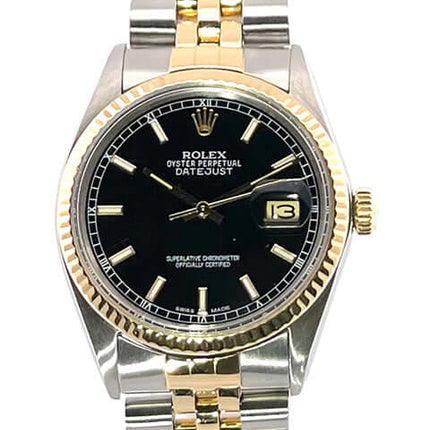 Rolex Datejust 36 Edelstahl Gelbgold 16013 mit schwarzem Zifferblatt, geriffelter Gelbgold Lünette und Jubiléarmband in Edelstahl/Gelbgold