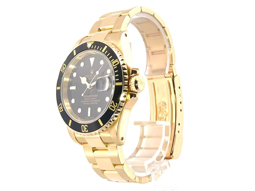 Rolex Submariner Date 16618 Gelbgold, poliertes 18 Karat Gelbgoldgehäuse und Armband, schwarze Lünette mit 60-Minuten-Skala, schwarzes Zifferblatt.