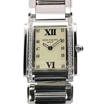 Patek Philippe Twenty-4 Edelstahl Ref. 4910/10A-011 Uhr mit Edelstahlgehäuse, Diamanten, weißem Zifferblatt, und Edelstahlband.
