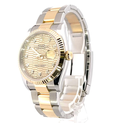 Rolex Datejust 36 Oystersteel Gelbgold Ref. 126233, goldfarbenes Riffelmuster Zifferblatt mit 10 Diamanten, geriffelte 18 kt Gelbgold Lünette.